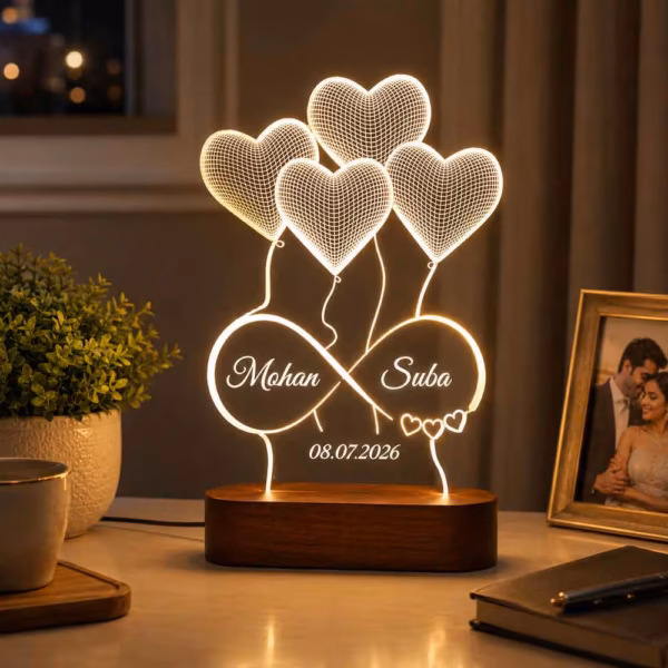 - personalizedgift.in A personalized acrylic infinity LED lamp with heart balloon design, engraved custom names and date, mounted on a premium wooden base with warm white LED illumination. An ideal personalized gift for weddings, anniversaries, engagements, Valentine's Day, and romantic occasions.
